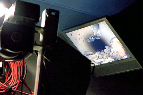 Tiny closed circuit television (CCTV) camera photographs the drains and see real-time images of debris