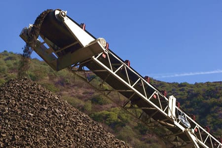 Crusher stacks materials for later use as base for new 405 carpool lane roadway.