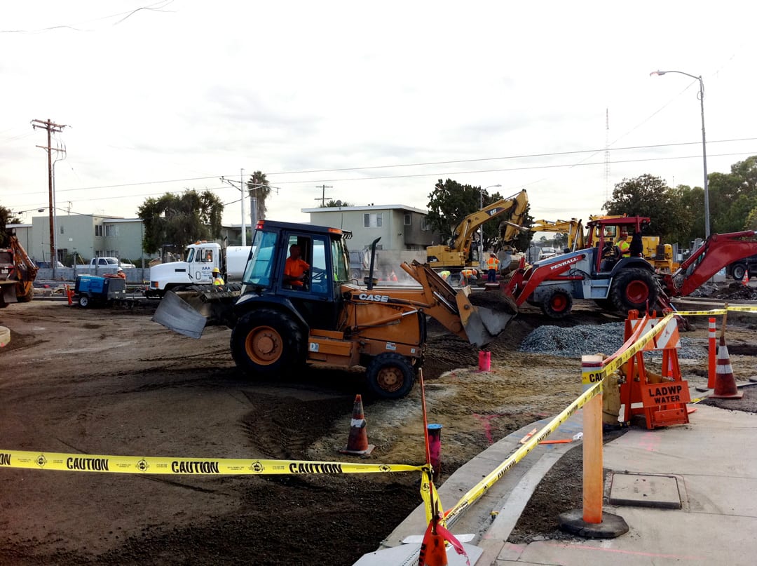 Construction workers rebuild the intersection of Exposition Blvd. and Farmdale Ave. in for the street crossing and station stop. Construction workers rebuild the intersection of Exposition Blvd. and Farmdale Ave. in for the street crossing and station stop.
