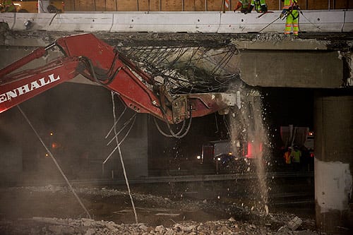 I-405 construction crews remove concrete from Skirball Bridge.