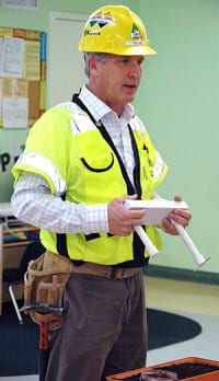 Dan Kulka, the prime contractor’s Public Relations Manager for the I-405 Project, demonstrates how the weight of a bridge must be supported.