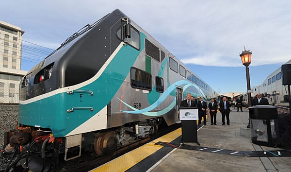 Metrolink safety car launch Metrolink CEO John Fenton at the launching of new Hyundai Rotem safety cars at Union Station platform in December 2010. Both Fenton, at podium, and Metrolink Board Chairman Richard Katz, background at left, will speak at the Steel Wheels conference. A similar platform exhibit is planned. (Photo by Gary Leonard)