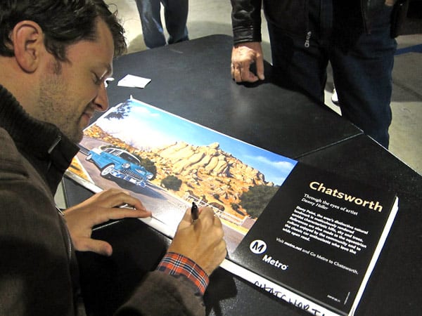 Artist Danny Heller signs iconic "Chatsworth" poster commissioned by Metro in the "Through the Eyes of Artists" series.