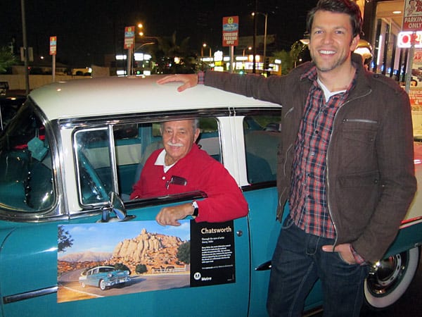 Artist Danny Heller, right, greets Joe DiFatta in his '55 Chevy Bel Air featured in Metro's 'Chatsworth' poster pictured here.