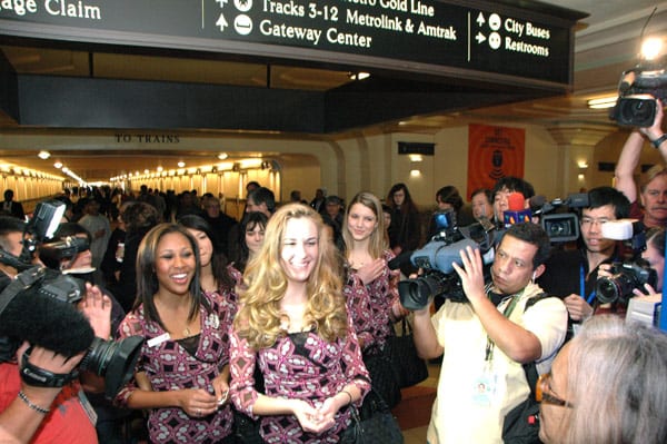 2012 Rose Queen Drew Helen Washington, at left, Princess Morgan Eliza Devaud and Princess Kimberly Victoria Ostiller greet transit patrons at Union Station. Photos by Luis Inzunza