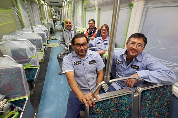 Paint shop crew. Back row: Jim Reyes, left, Alan Cota right, Center row: Lee Hetherington. Front row: Ivan Rodriguez, left, Guillermo Hernandez, right.