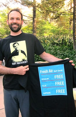 Car-free cyclist Nate Baird, an LADOT bike program planner, wears his blessings at Good Samaritan Hospital bike week event.