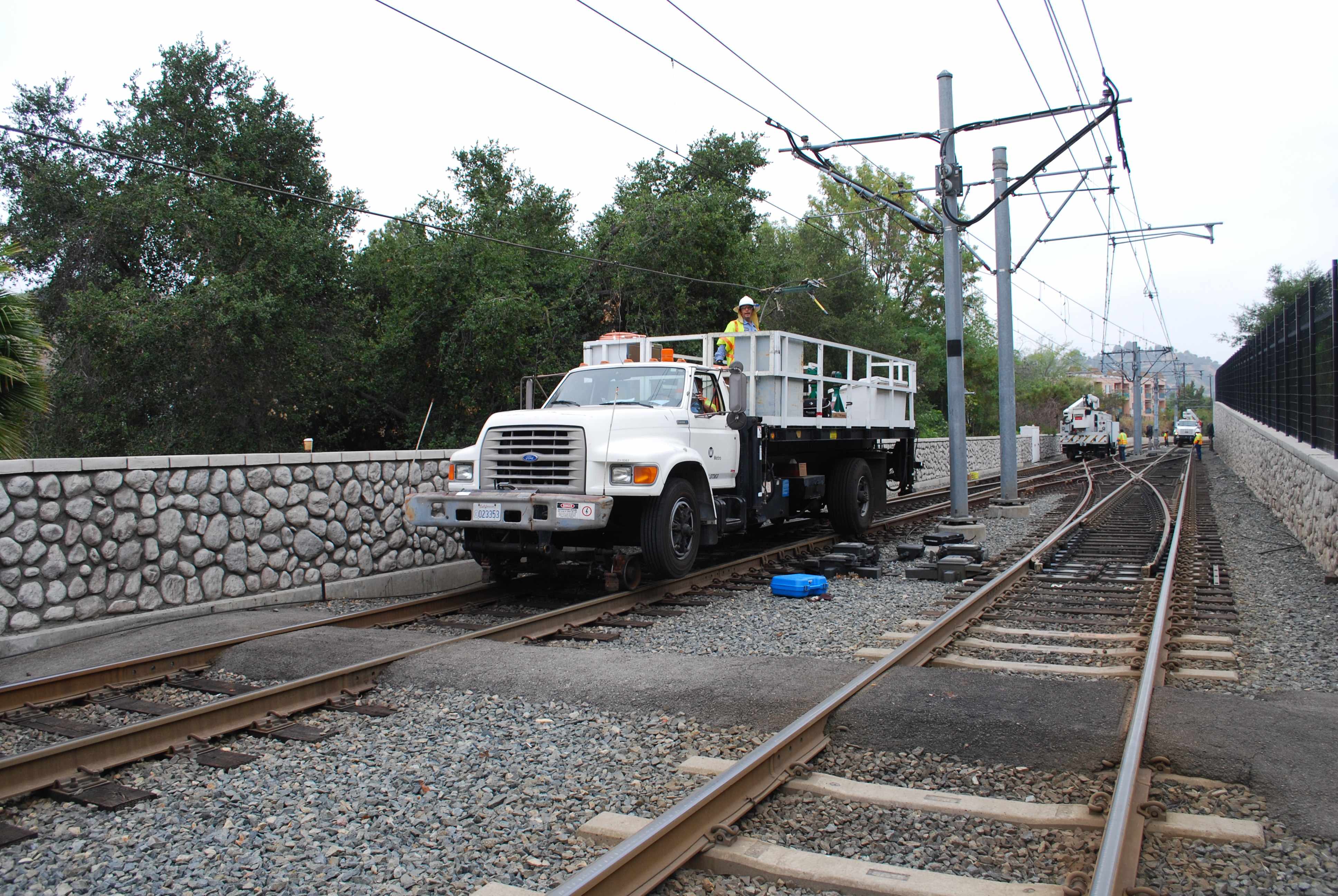 Traction power crew repairs overhead power system at the Metro Gold Line's Southwest Museum Station. Photo by Kelvin Zan.