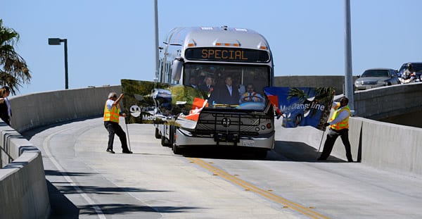 Banner Bus Metro Orange Line bus breaks through banner at dedication event held at the new CHatsworth Station. Yes, that's Mayor Antonio Villaraigosa and Los Angeles County Supervisor Zev Yaroslavsky in the operator's cab. Photo by Gary Leonard.