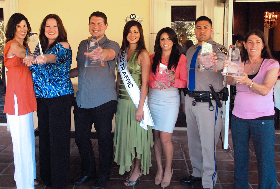 Winners of the 2012 Golden Pylon Awards: from left, carpooling team of Nora Wells and Sioux-z Jessup report traffic on several radio stations, Total Traffic L.A. powerhouse Nick Pagliochini, Metro's reigning 'Miss Traffic' Sofia Mach, KABC Air Watch Kalyna Astrinos, CHP Officer Juan Galvin, and KFWB veteran Rhonda Kramer. 