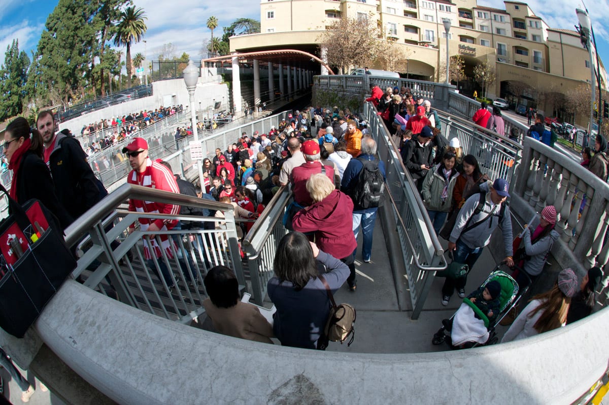 Parade goers exit as Rose Bowl fans arrive at Memorial Park Station. Photo by Gary Leonard.