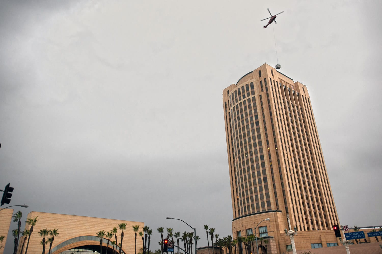 Helicopter "lifts" 4-ton cooling towers to the roof the the 27-story Metro HQ on Dec. 29. The second and final lift is set for Saturday morning. Photo by Josh Southwick. 