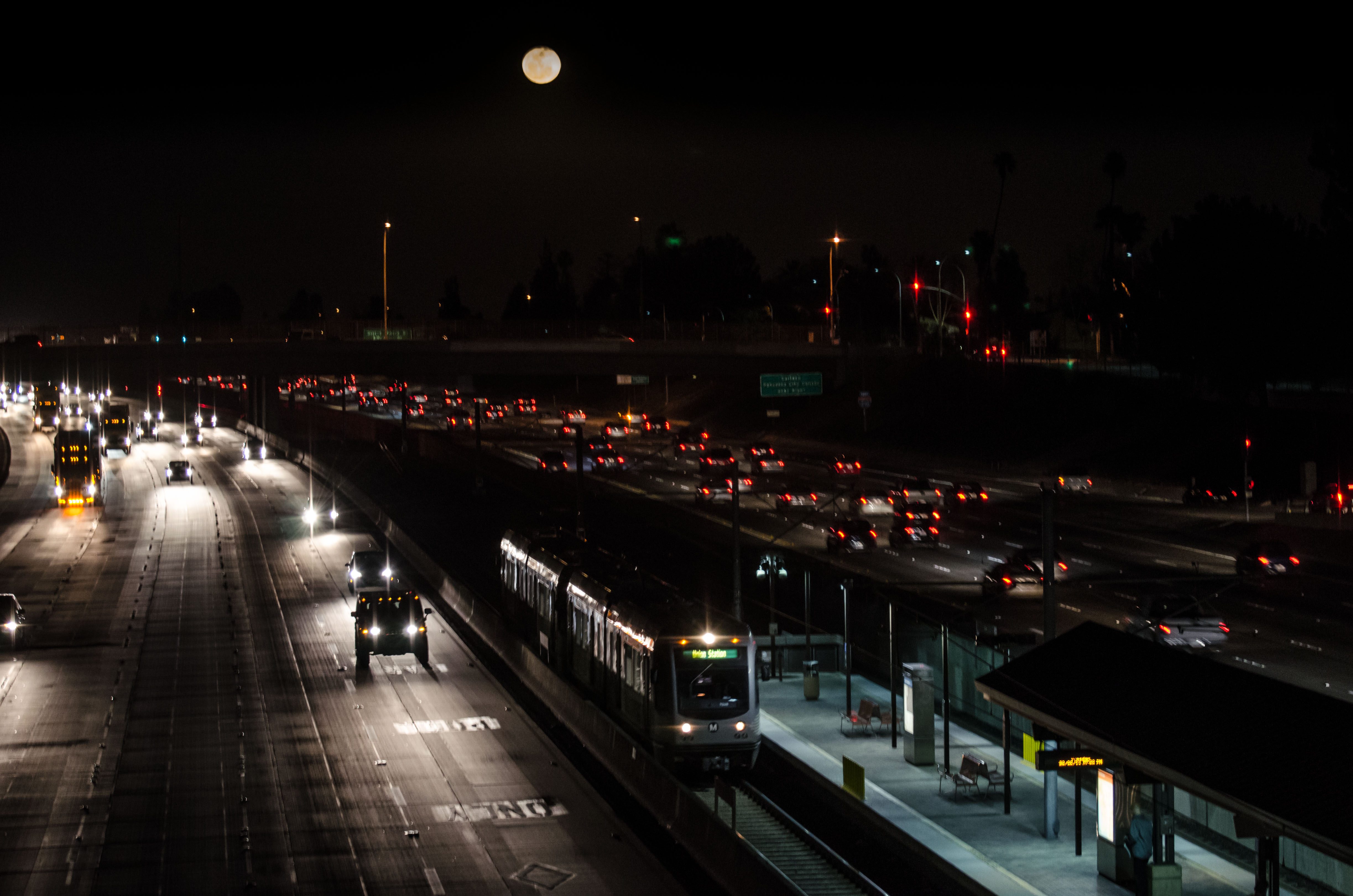 ART OF TRANSIT: A full moon hovers over the Gold Line's Lake Avenue Station in the middle of the 210 freeway in Pasadena. No, I didn't add the moon in Photoshop -- it was there and it was orange-ish. Click above to see larger. Photo by Steve Hymon/Metro.