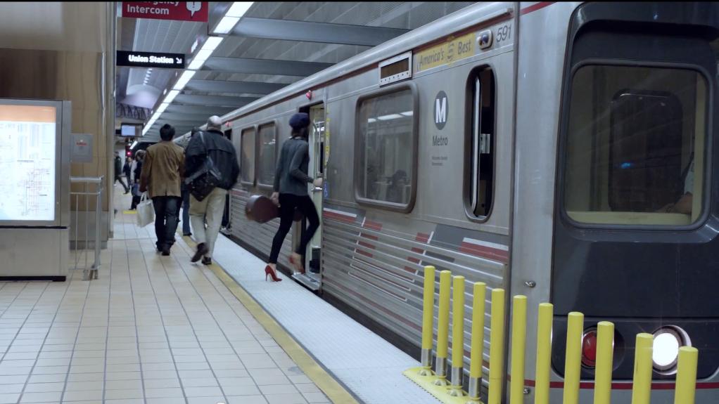 A woman steps inside a Metro train in a new Google ad.