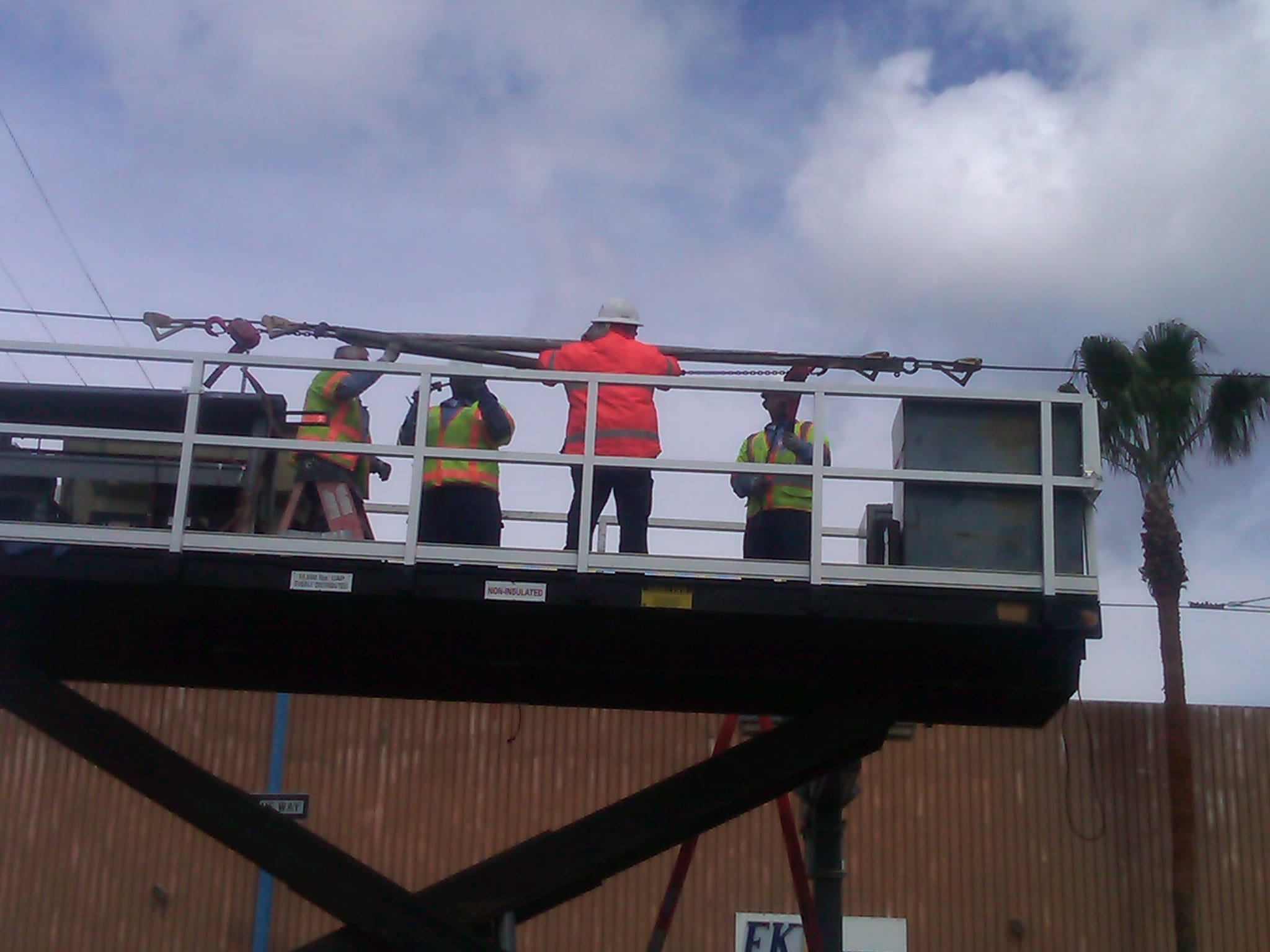 Workers repairing damaged power line.