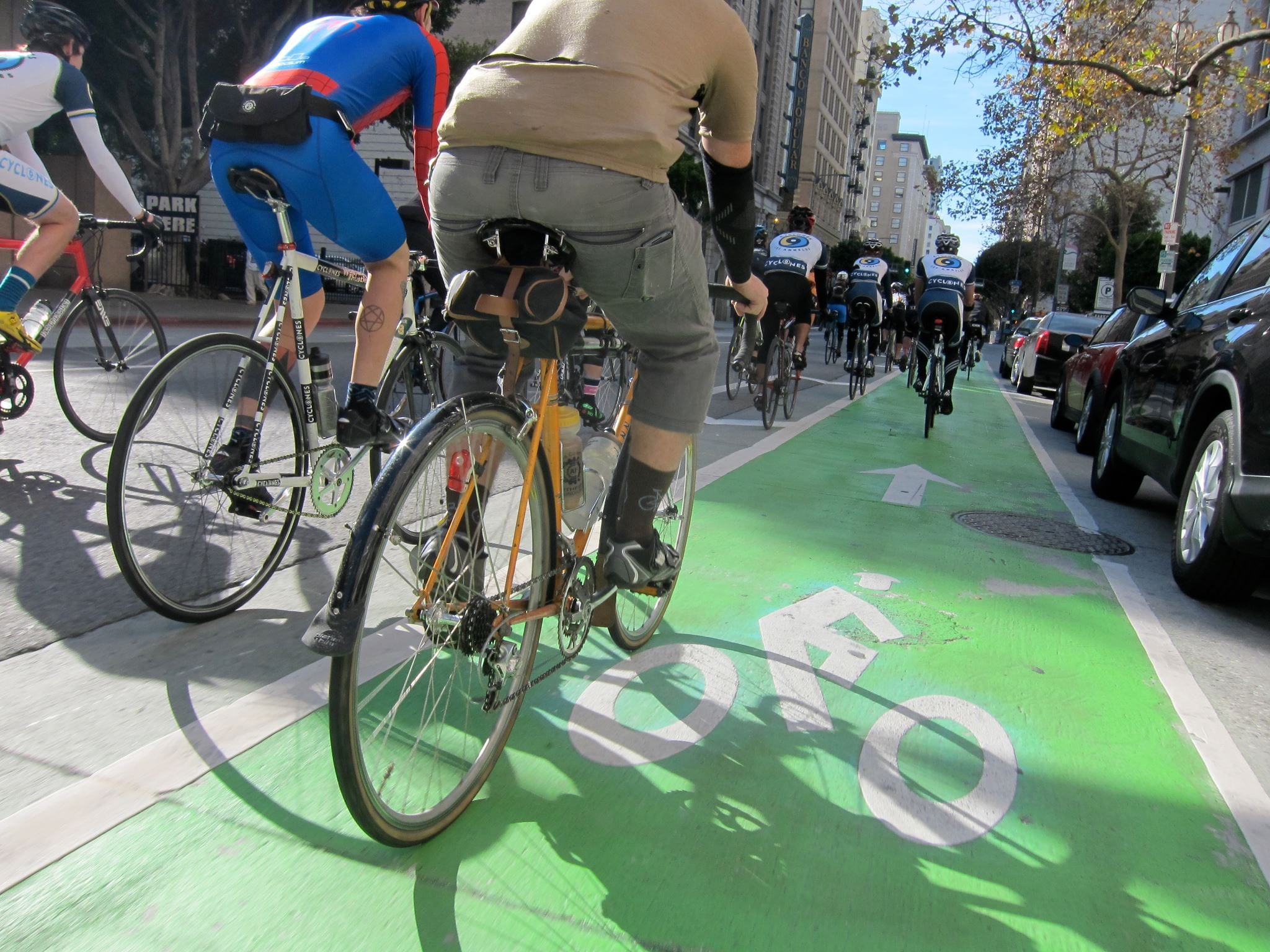 Cyclists using Spring St.'s green bike lane. Photo by Jances Certeza.