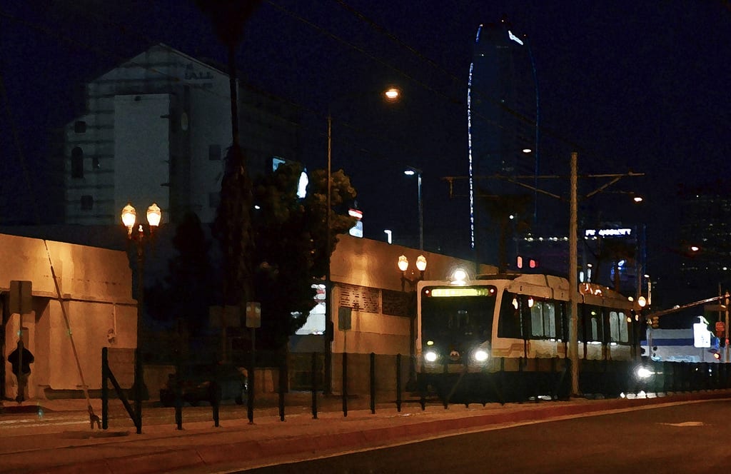 A photo illustration of the Expo Line at night on Flower Street. By Steve Hymon/Metro. 