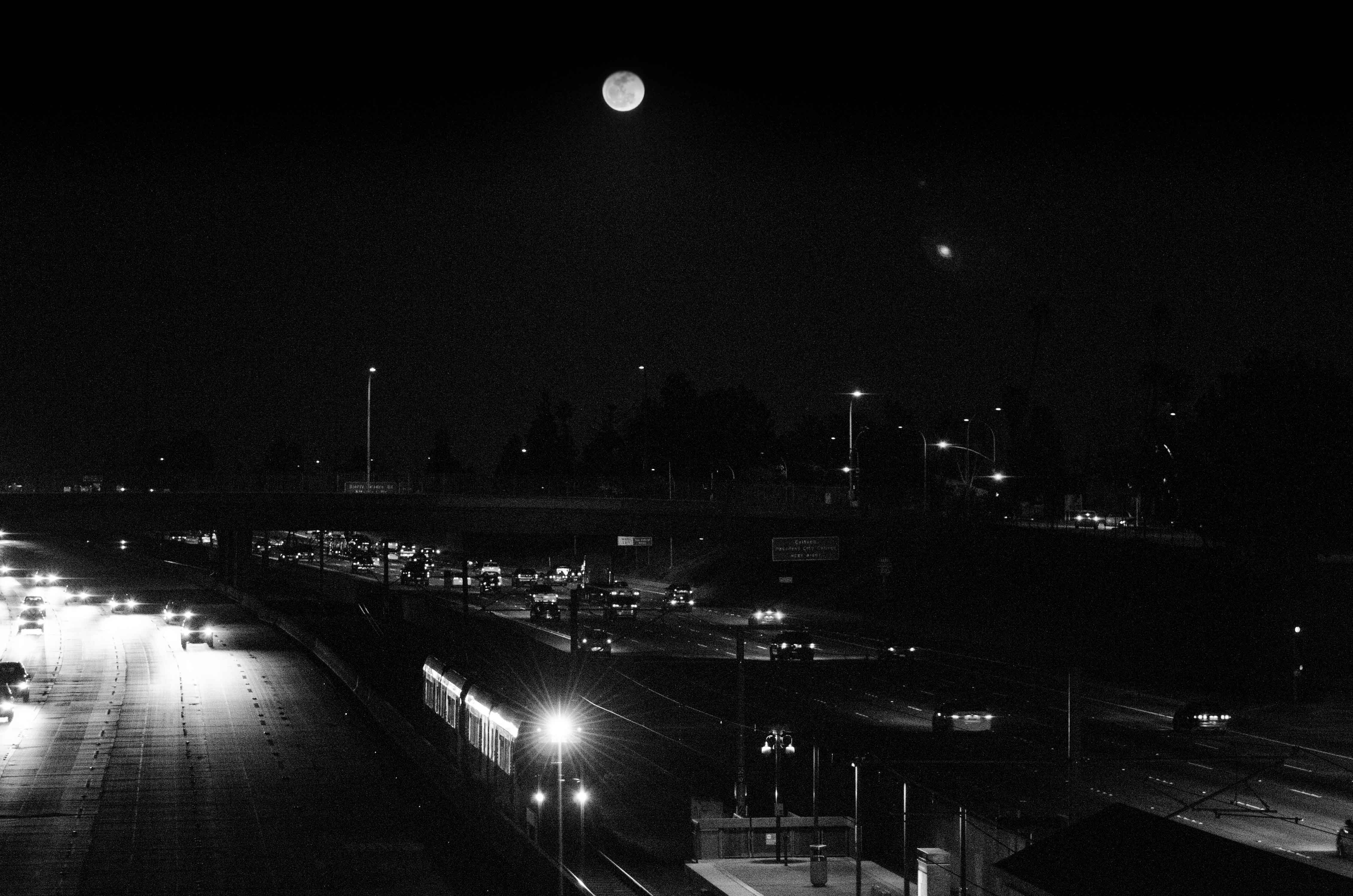 ART OF TRANSIT: It's a full moon on Sunday night, meaning it's time for another Metro Full Moon Photo Challenge. Get the full moon in a photo with a Metro bus or train and we'll feature it in this space, earning you great amounts of fame on the World Wide Web. Booya! Photo by Steve Hymon/Metro, taken in February from the Lake Avenue bridge over the Gold Line and the 210 freeway.