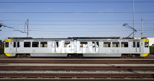 Side view of the new paint and decal styling designed by Metro Creative Services, including “Metro” supergraphics and yellow dot patterns conveying motion and Southern California sunlight. Nighttime and daytime train visibility has been greatly enhanced.