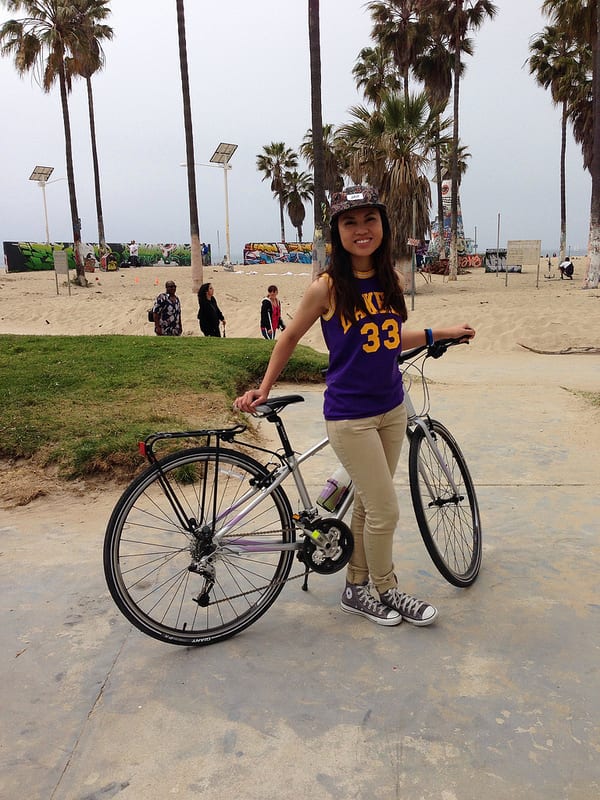 Maria poses with her bike at Venice Beach.
