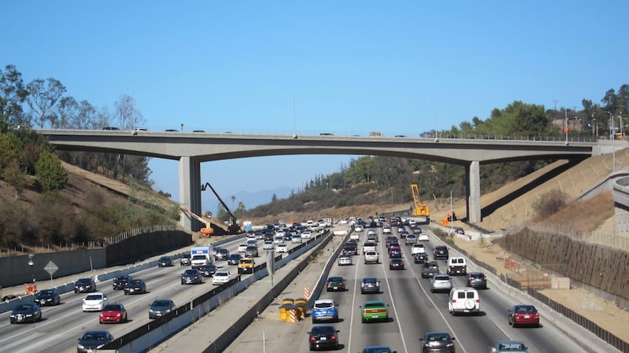 The seismically updated Mulholland Bridge now allows the construction of a extra traffic lane below.