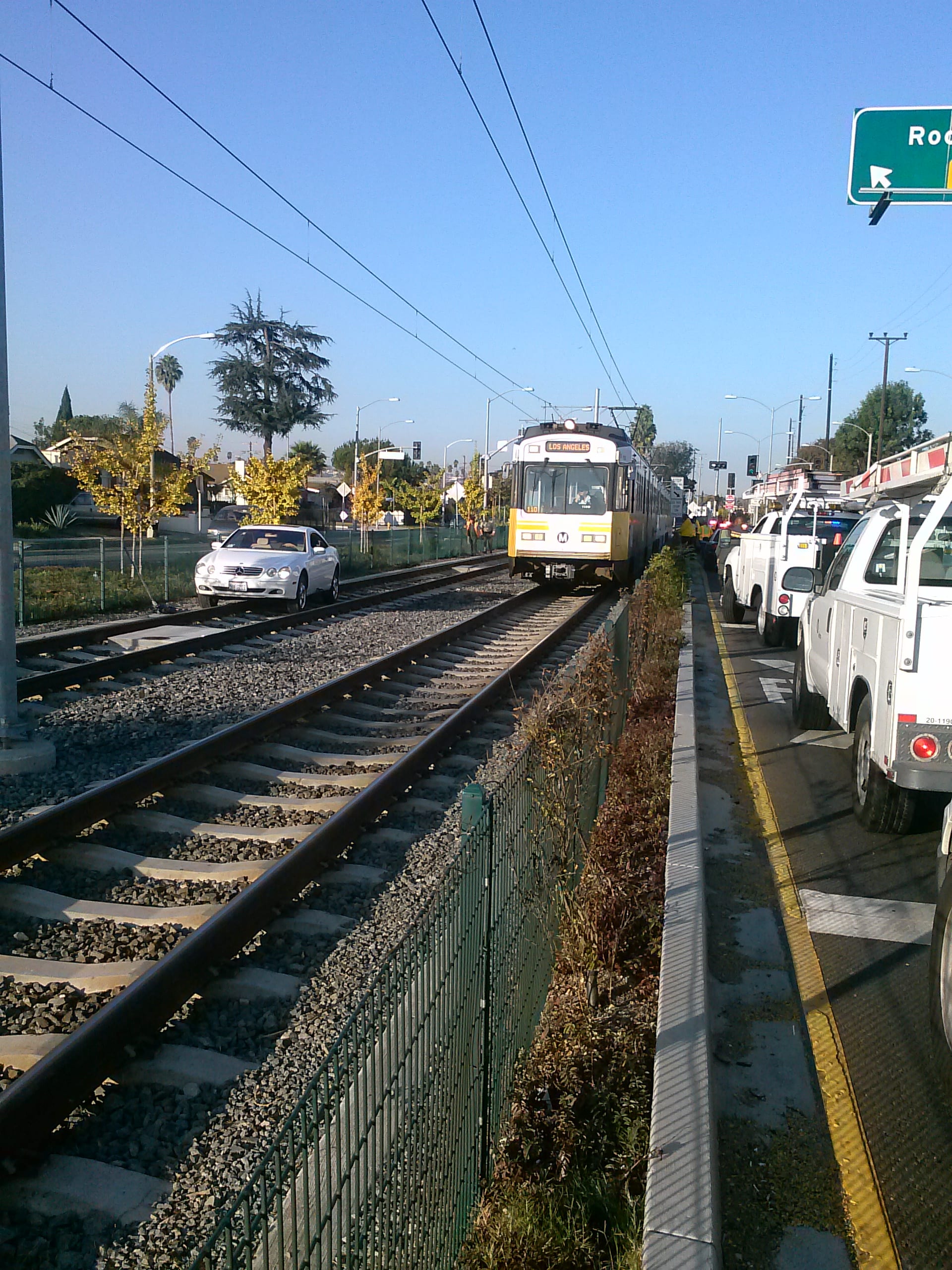 Car blocking the eastbound Expo Line tracks. Due to the location, it was very difficult to get a tow truck in to move the vehicle. Photo: Metro