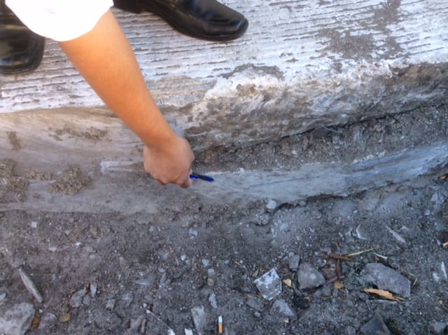 A Caltrans engineer shows the different layers of paving needed for the 80-hour operation.