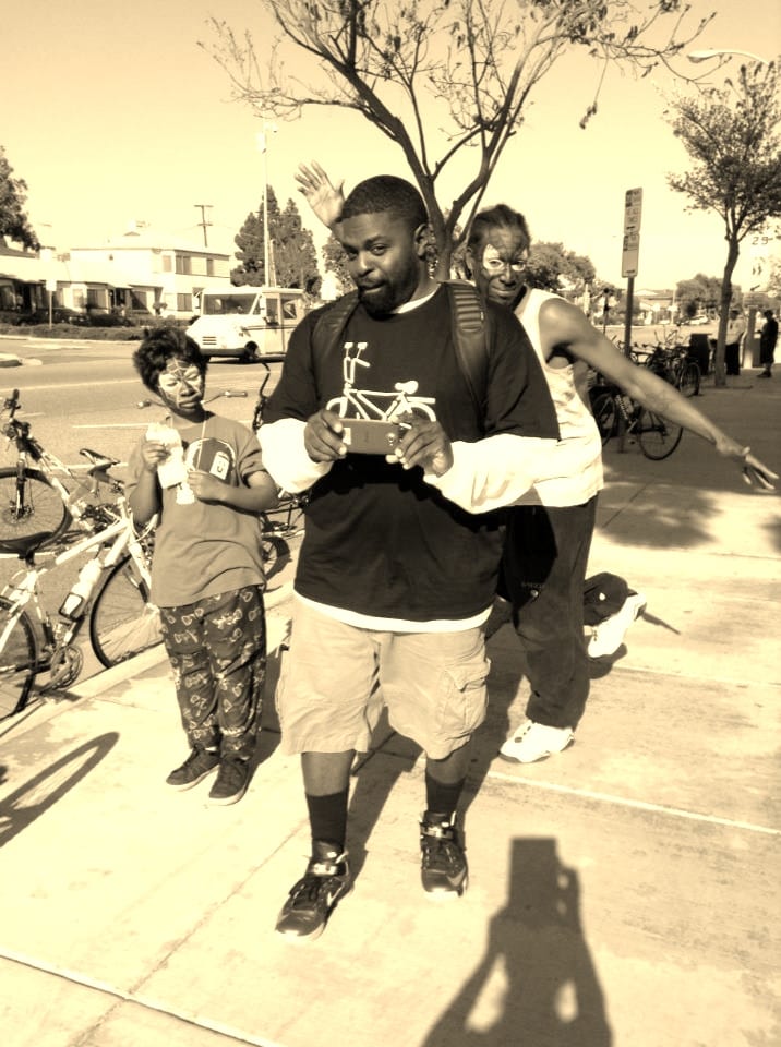 John Jones III, joined by community members in what seems to be a fun day of activities!