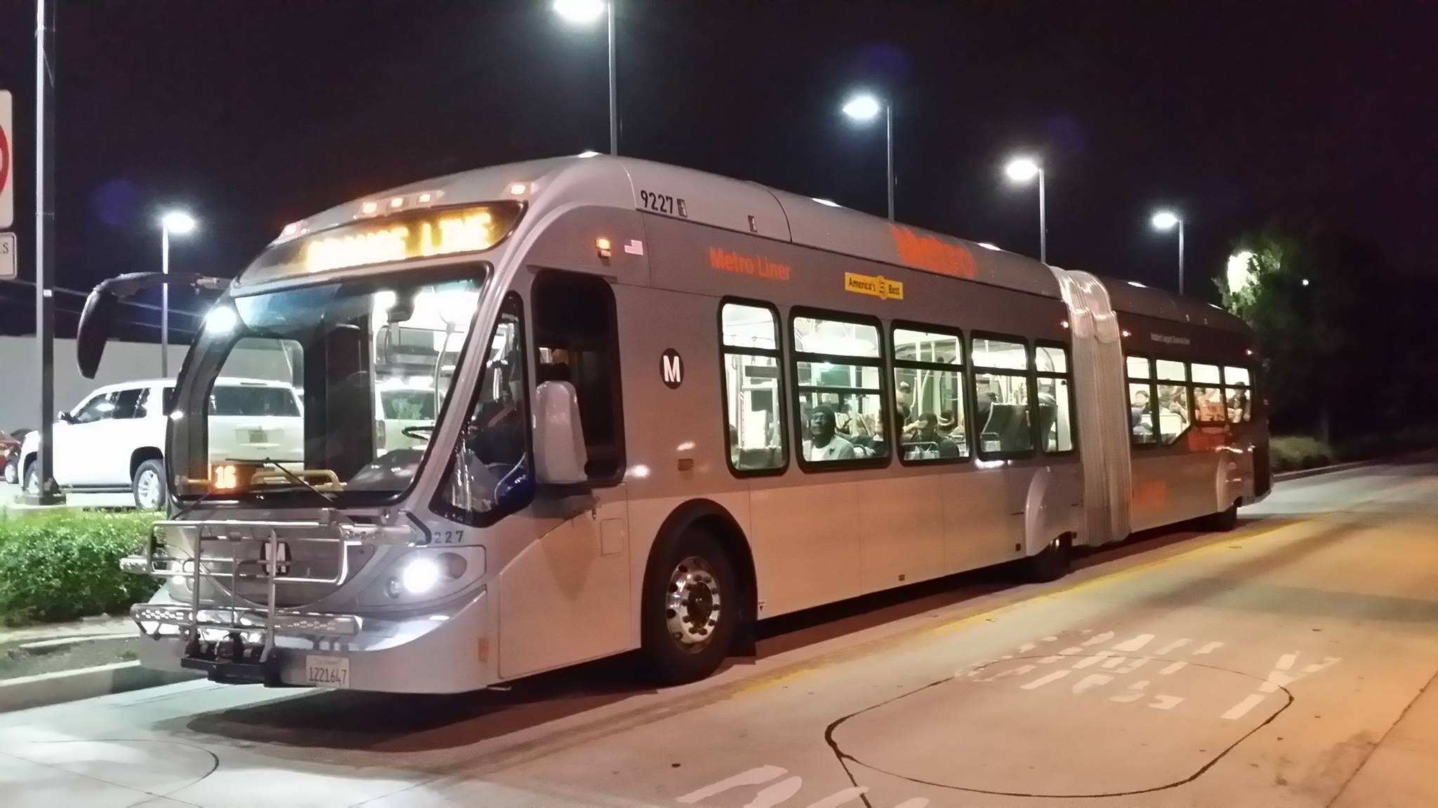 A blurry Orange Line bus heading eastbound into Van Nuys station. Photo by Jon Ross Alexander
