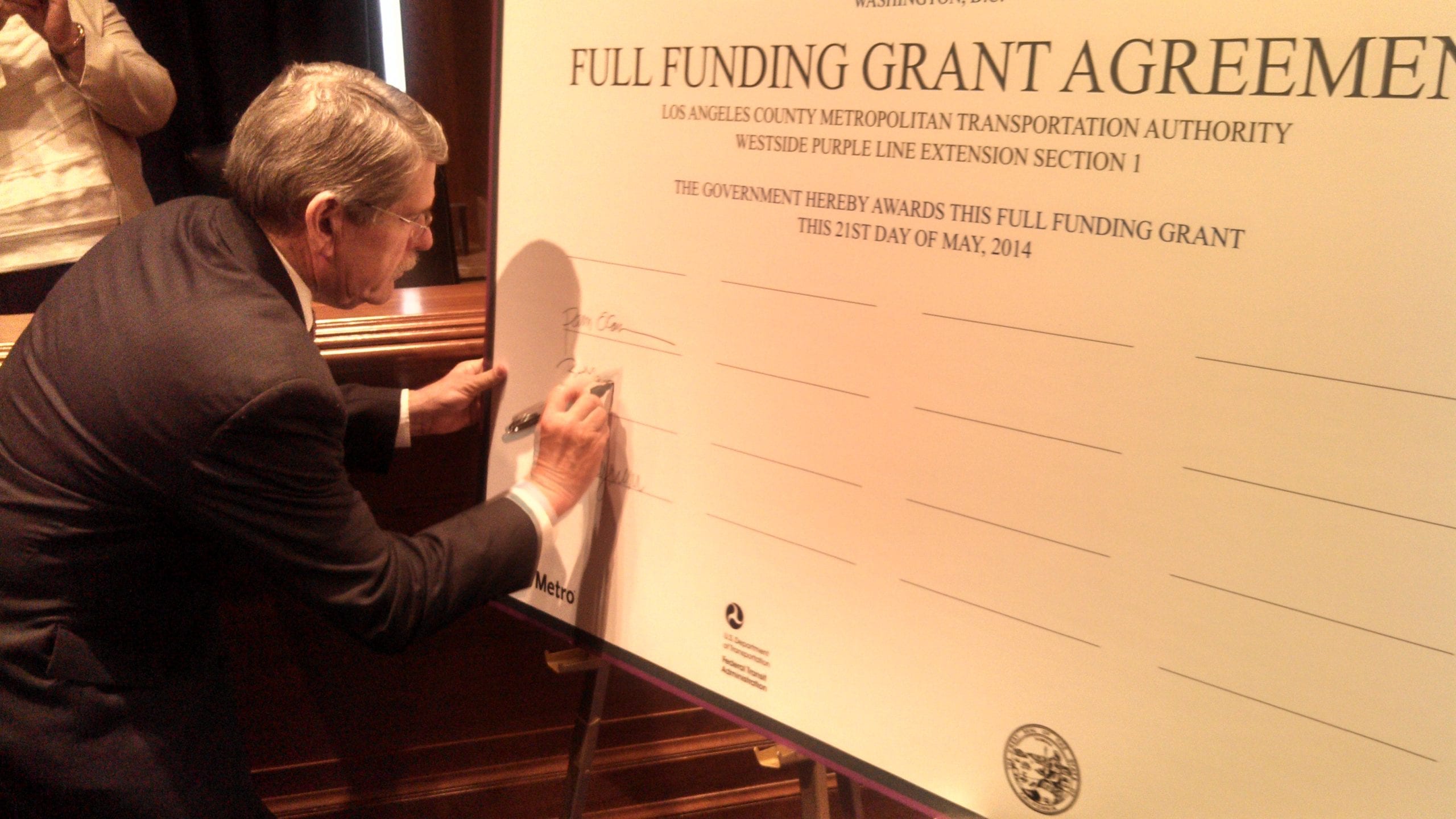 Metro Board Member Zev Yaroslavsky signing the funding deal this morning in D.C. 