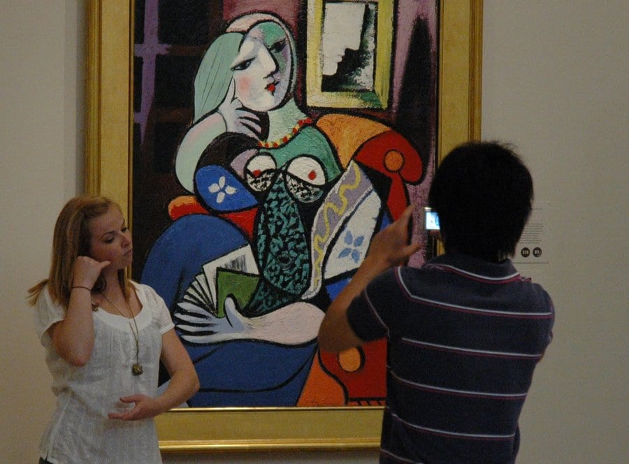 Visitors pose with Picasso's portrait of Marie Therese at the Norton Simon Museum, one of many Pasadena museums, galleries, and cultural institutions open late on ArtNight. Image by Glenn Zucman via Flickr/CC