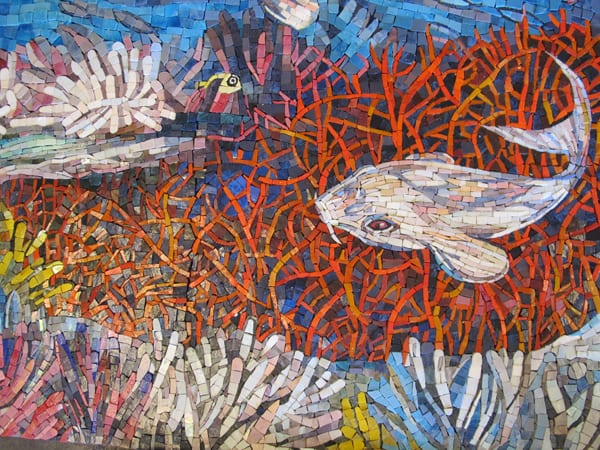 The photos above show details of two completed artwork panels.