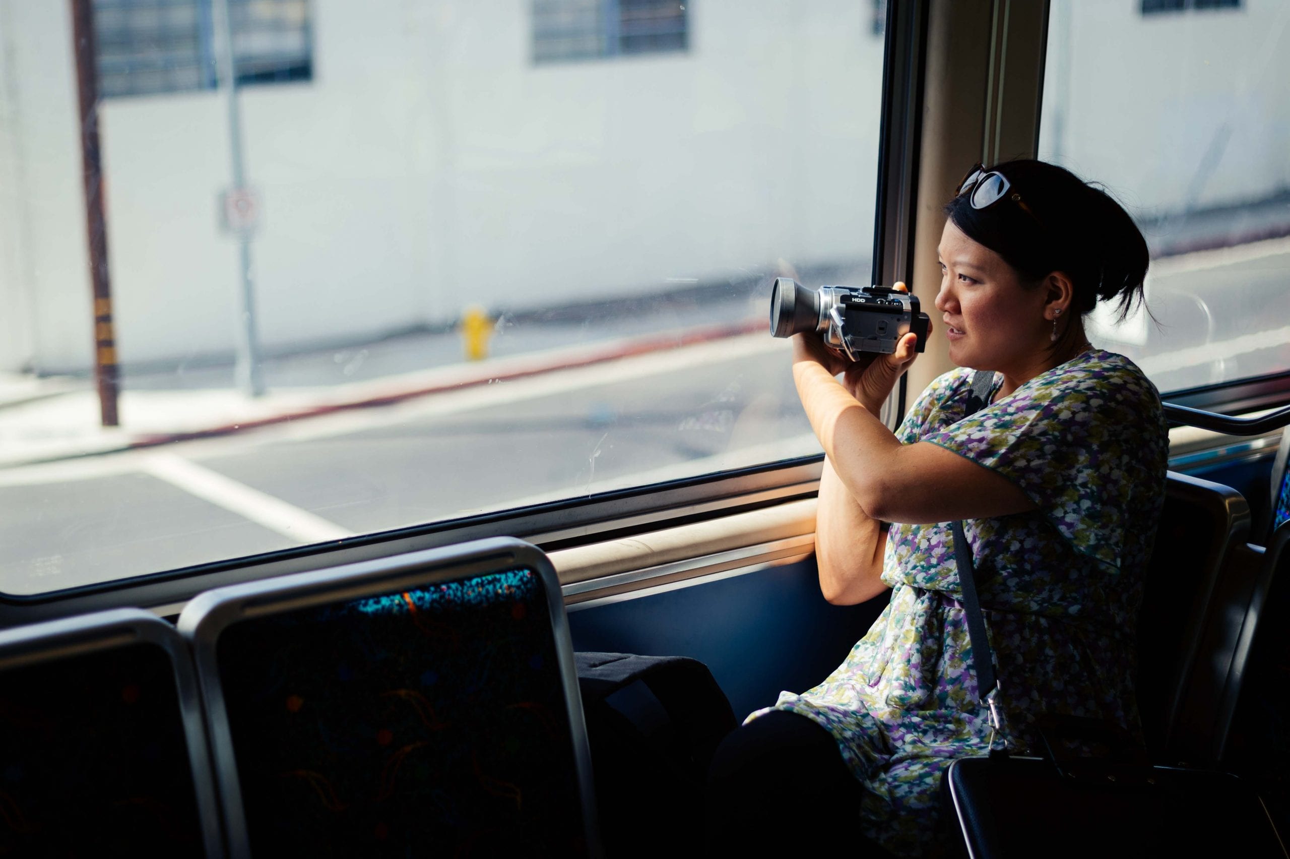 Art of Transit: My colleague Anna Chen collecting footage on the Expo Line for a video to promote ride sharing. Click above for recent posts on Rideshare Week. Photo by Steve Hymon/Metro.