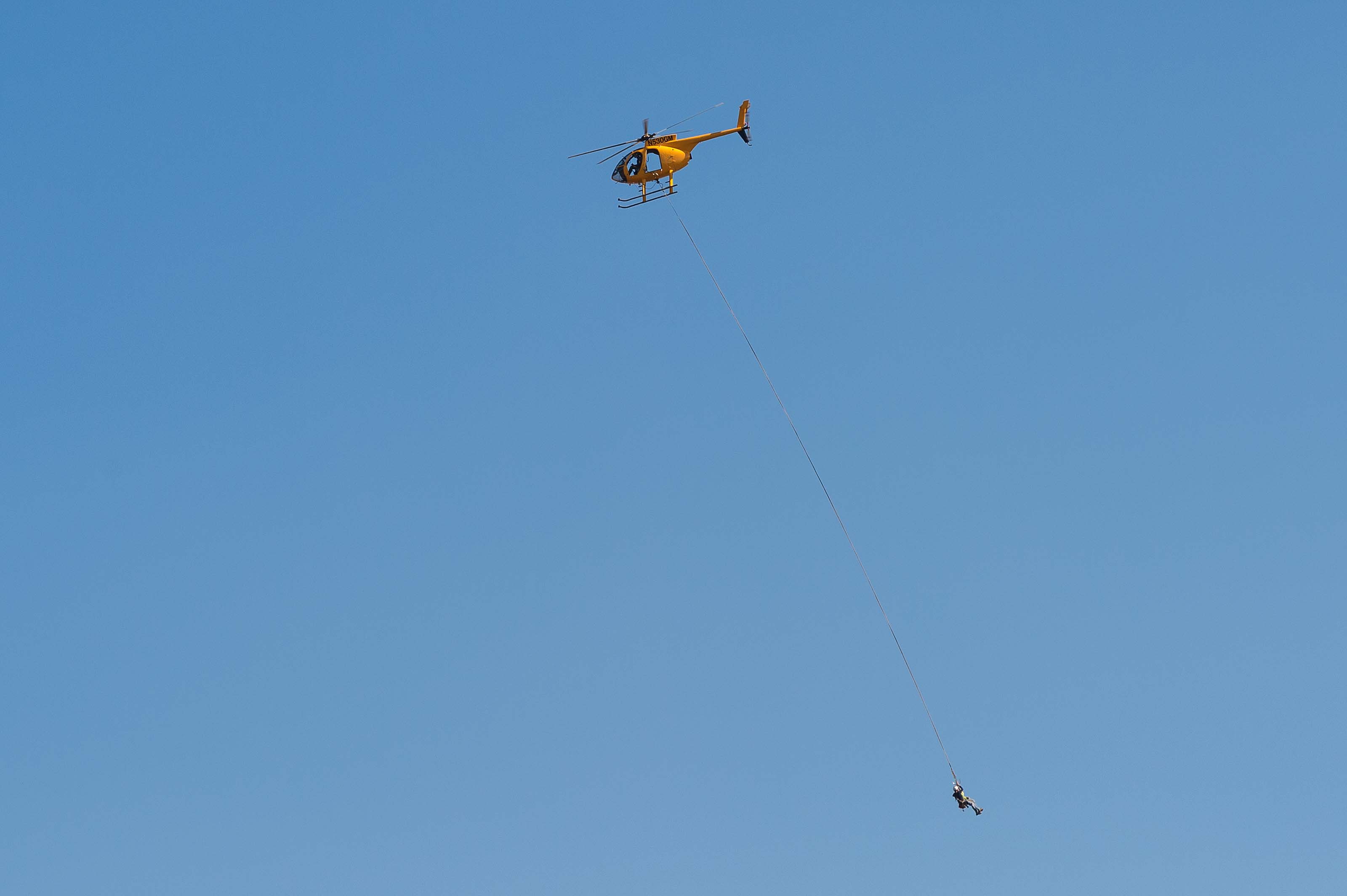 ART OF TRANSIT: I went for a hike in the Angeles National Forest on POTUS Day, looked up and saw this. There are actually two people dangling from the chopper -- they were doing work atop a nearby utility tower/transformer. Photo by Steve Hymon. 