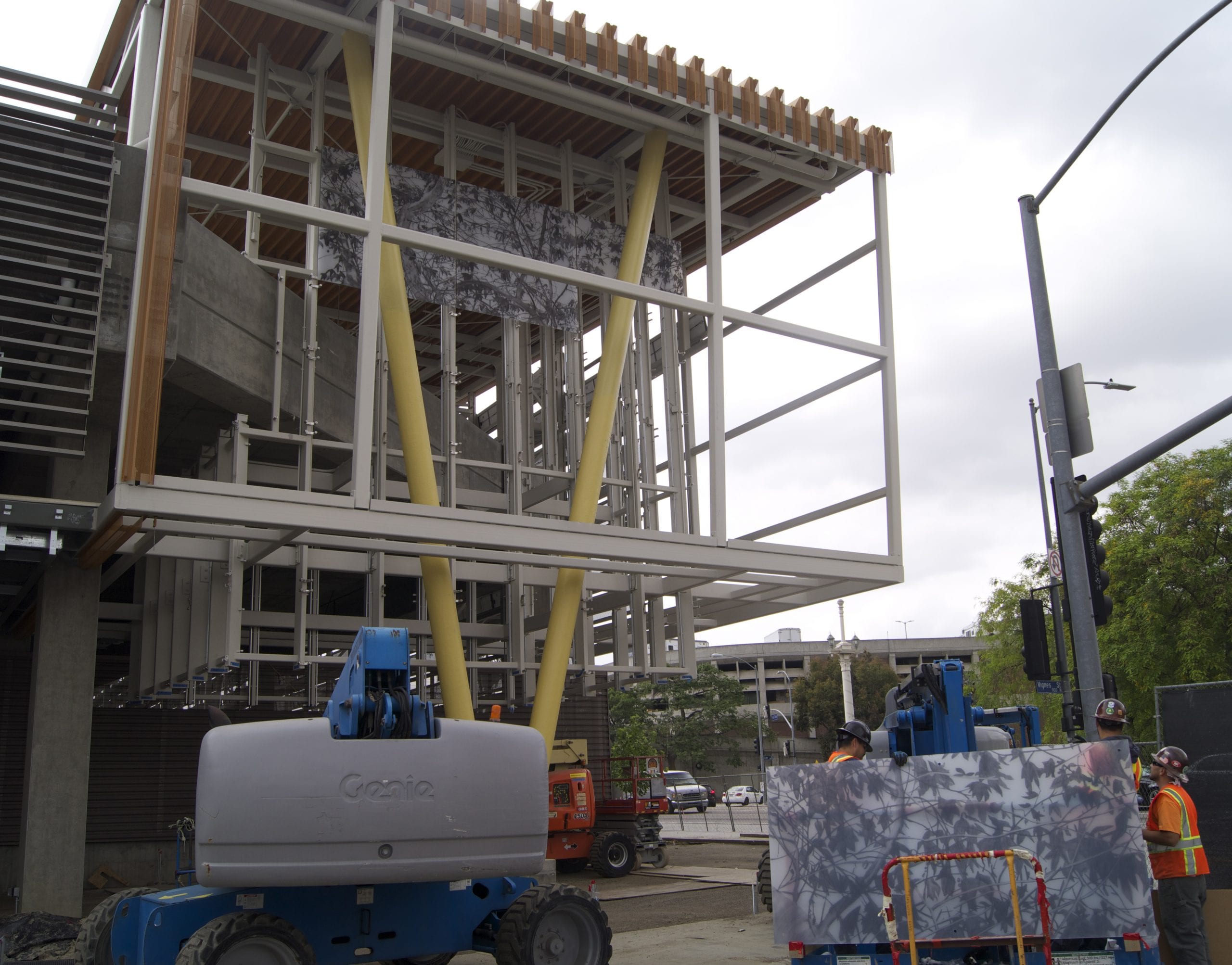 One of 80 panels comprising the artwork sits ready to be installed on the exterior facade of the Division 13 building.