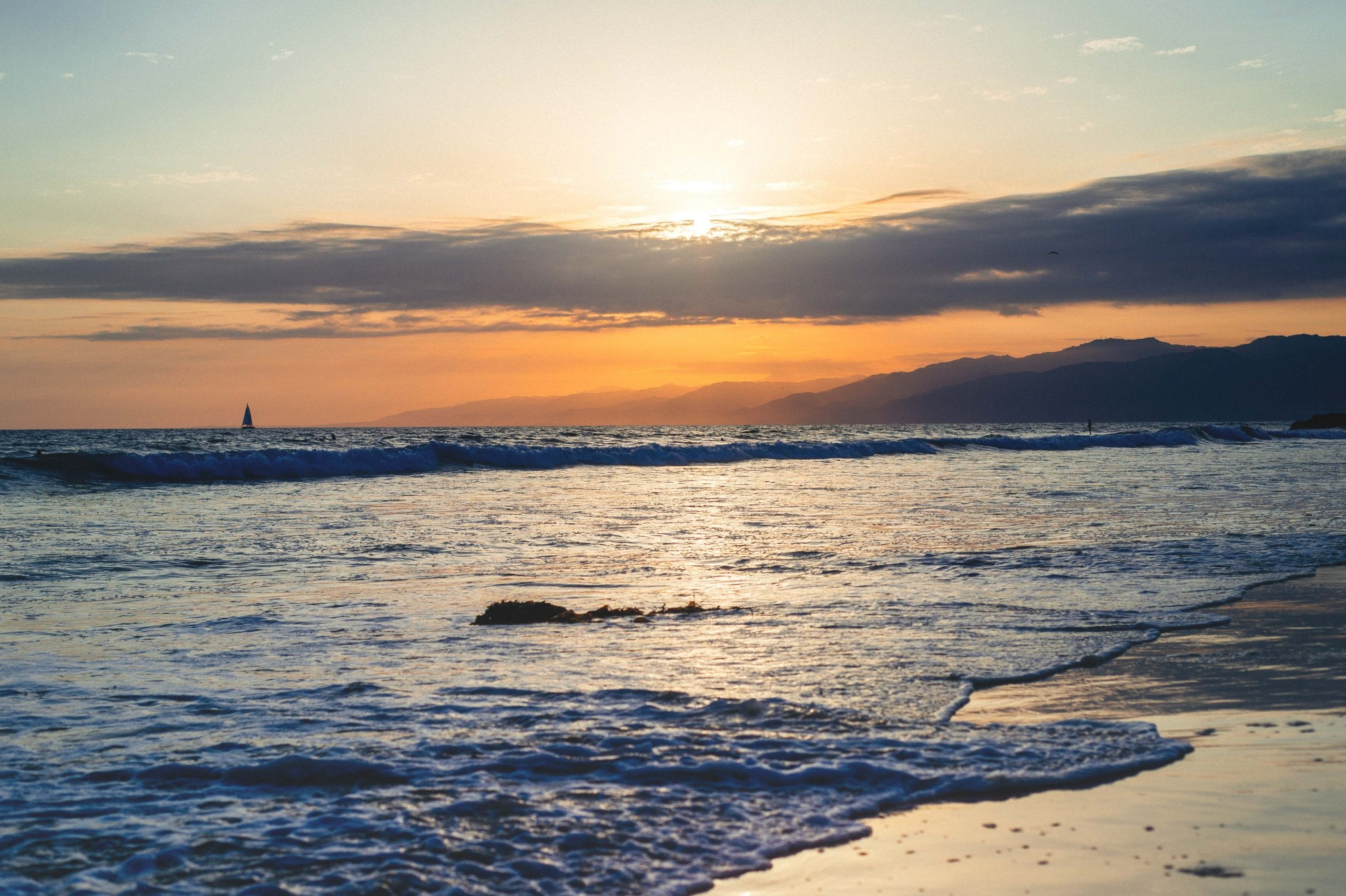 Art of Transit: Sailboat in Santa Monica Bay. Such sunsets will be more transit accessible in 2016 when the Expo Line opens with a station a stone's throw from the Santa Monica Pier. Booyahdiddy. Photo by Steve Hymon.