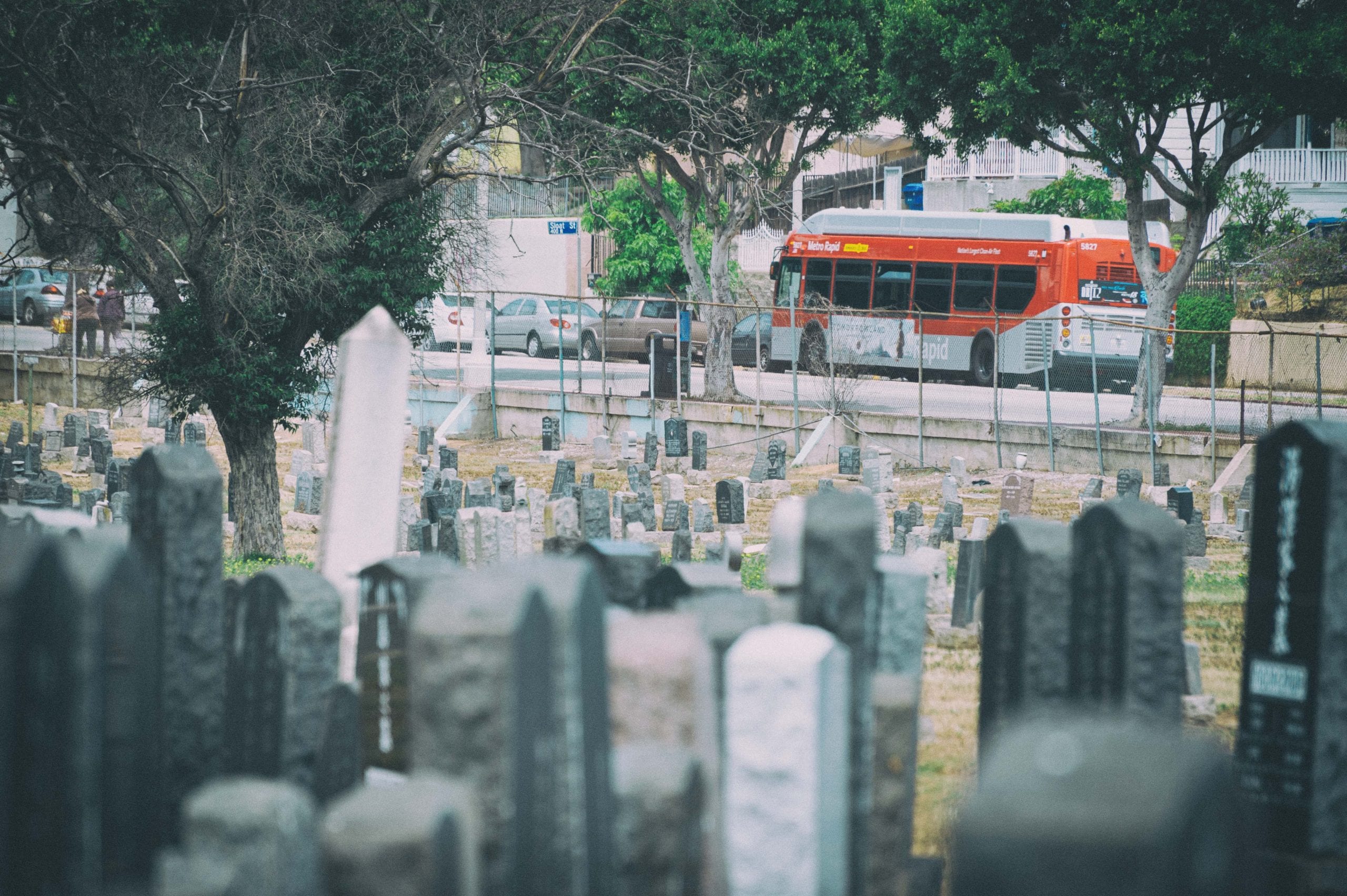 ART OF TRANSIT: That's the 770 Rapid as seen from Evergreen Cemetery in Boyle Heights. Yeah, a little creepy although the cemetery provides a glimpse into our area's rich history. Also accessible from the Local 30 and 68 buses and the Gold Line's Indiana Station. There's a nice walking path around the outside perimeter of the cemetery that is very popular, especially in the mornings and evenings. Photo by Steve Hymon/Metro.