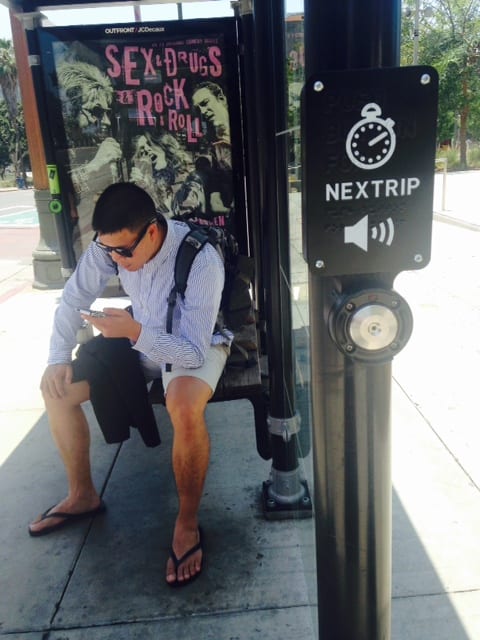 Real-time bus arrival button and Braille instruction