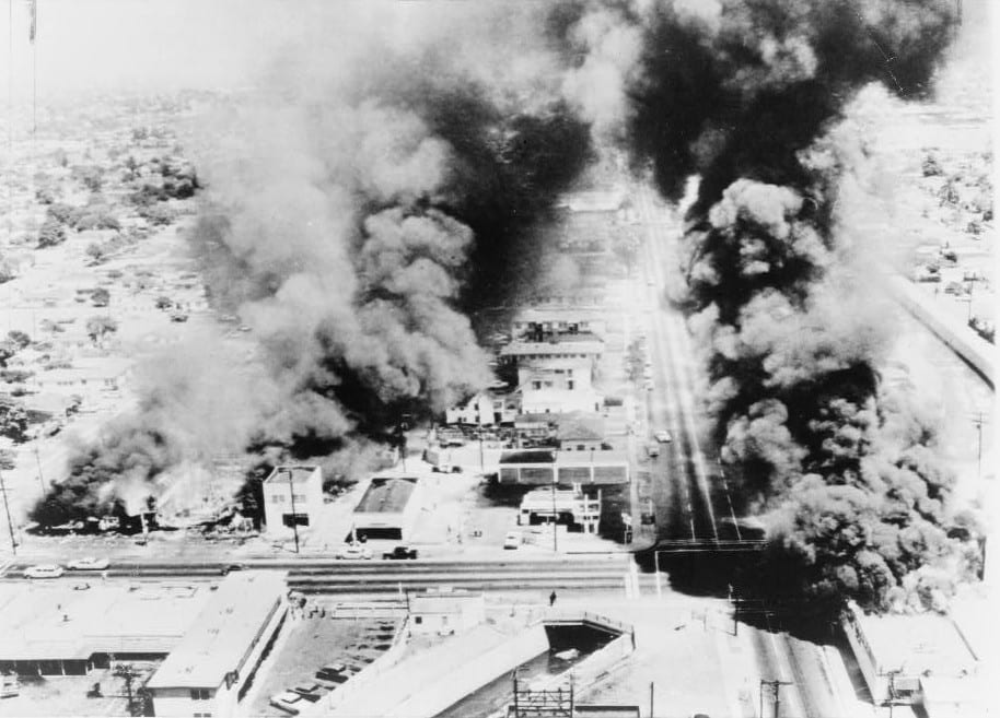 Buildings aflame in 1965. Photo: New York Telegram via Wikimedia.