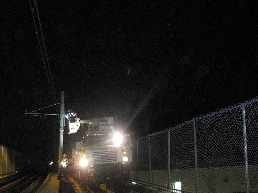 Work last night on repairing the overhead wires on the Gold Line bridge over the L.A. River. Photo: Metro.