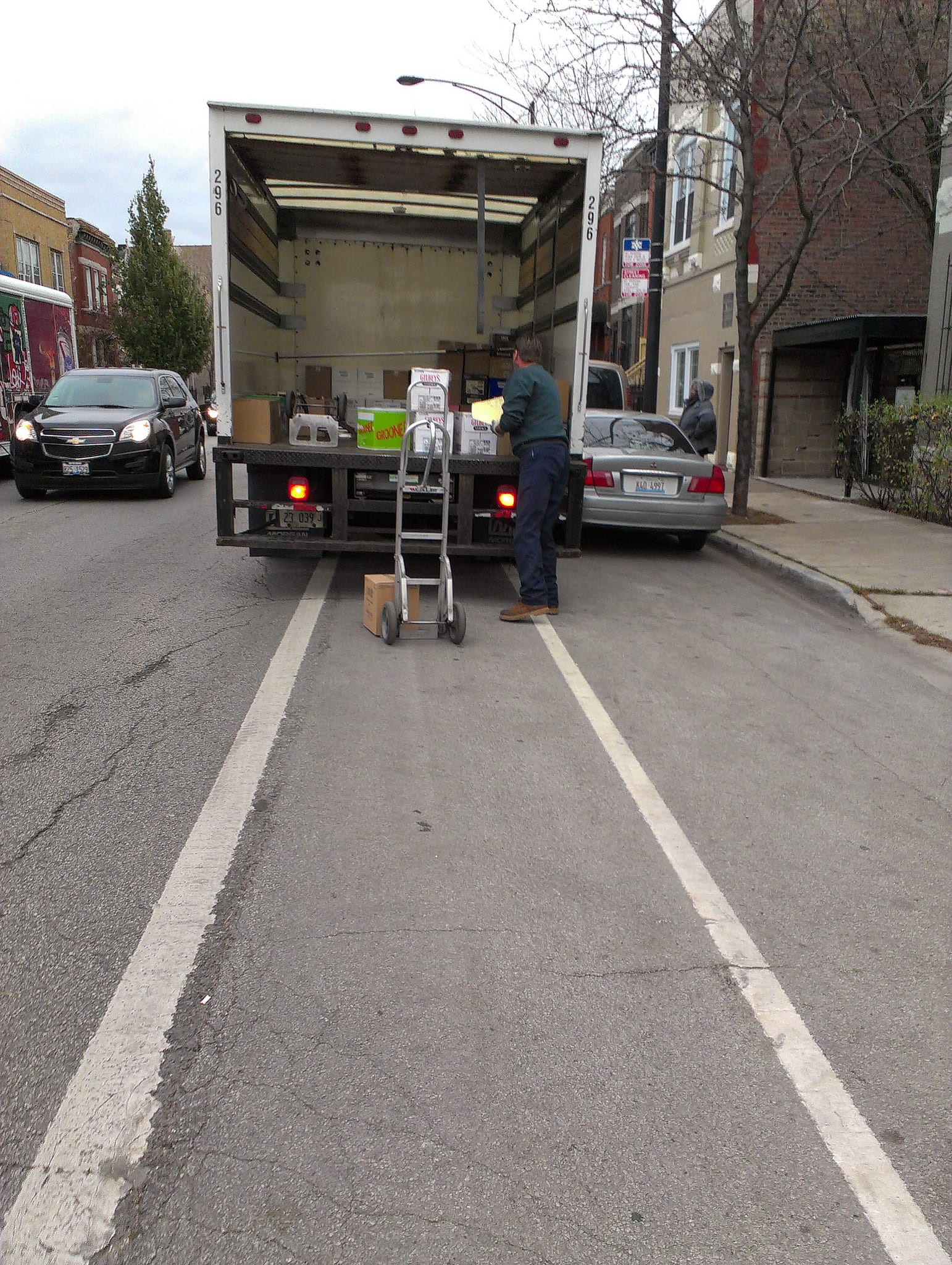 Delivery truck vs bike lane in Chi-town. Photo by get directly down, via Flickr creative commons. 