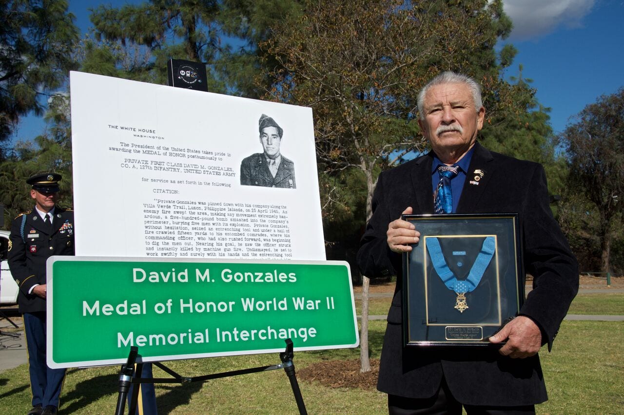 David M. Gonzales Jr. with his father's Medal of Honor.