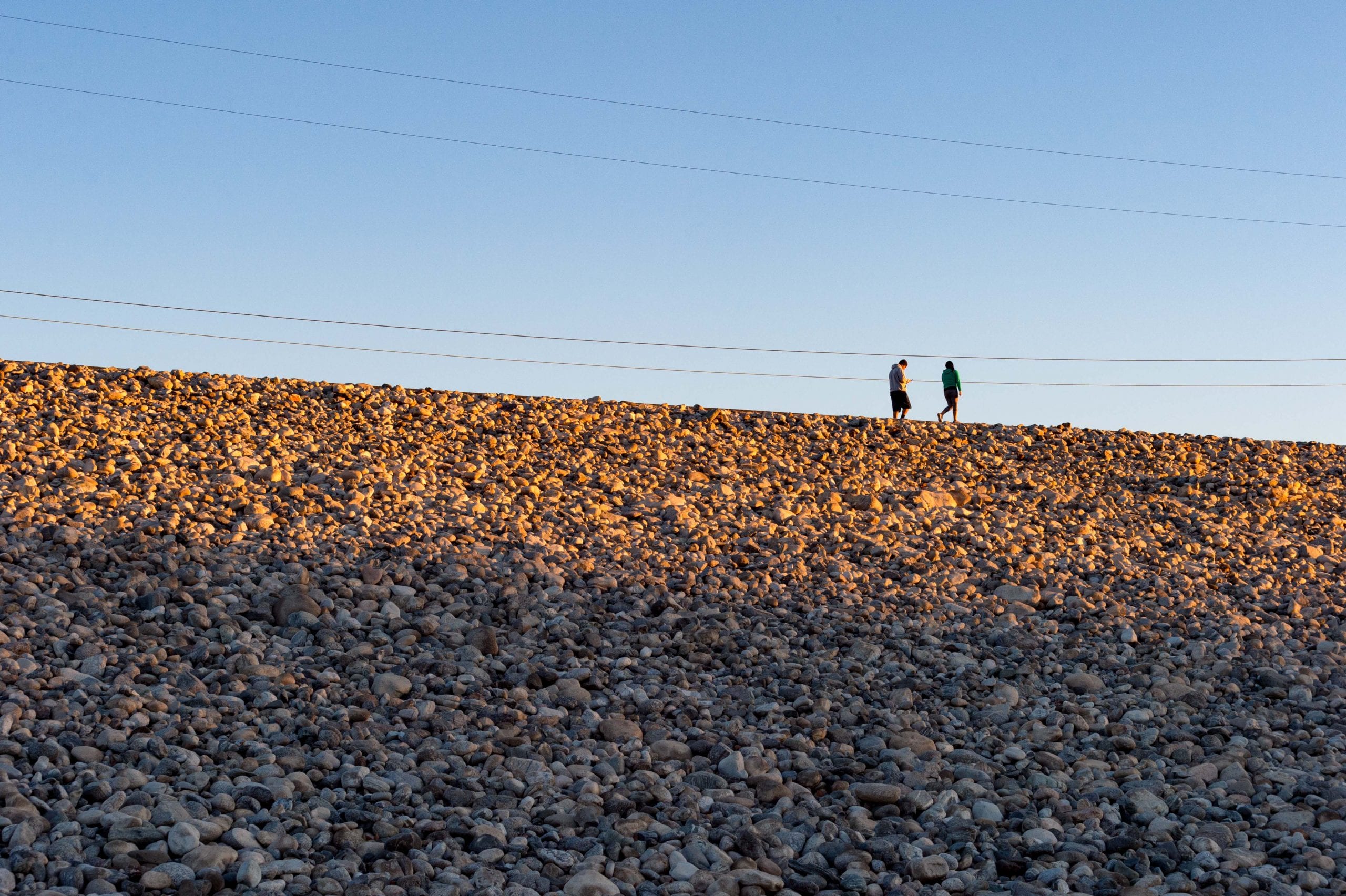 Walkers on the path atop the Santa Fe Dam in Irwindale. Photo by Steve Hymon/Metro.