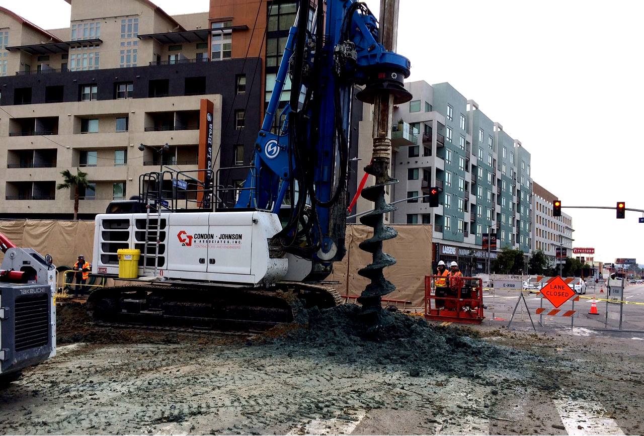 Workers drill a section of Wilshire Boulevard as part of the Purple Line Extension project's piling operation. 