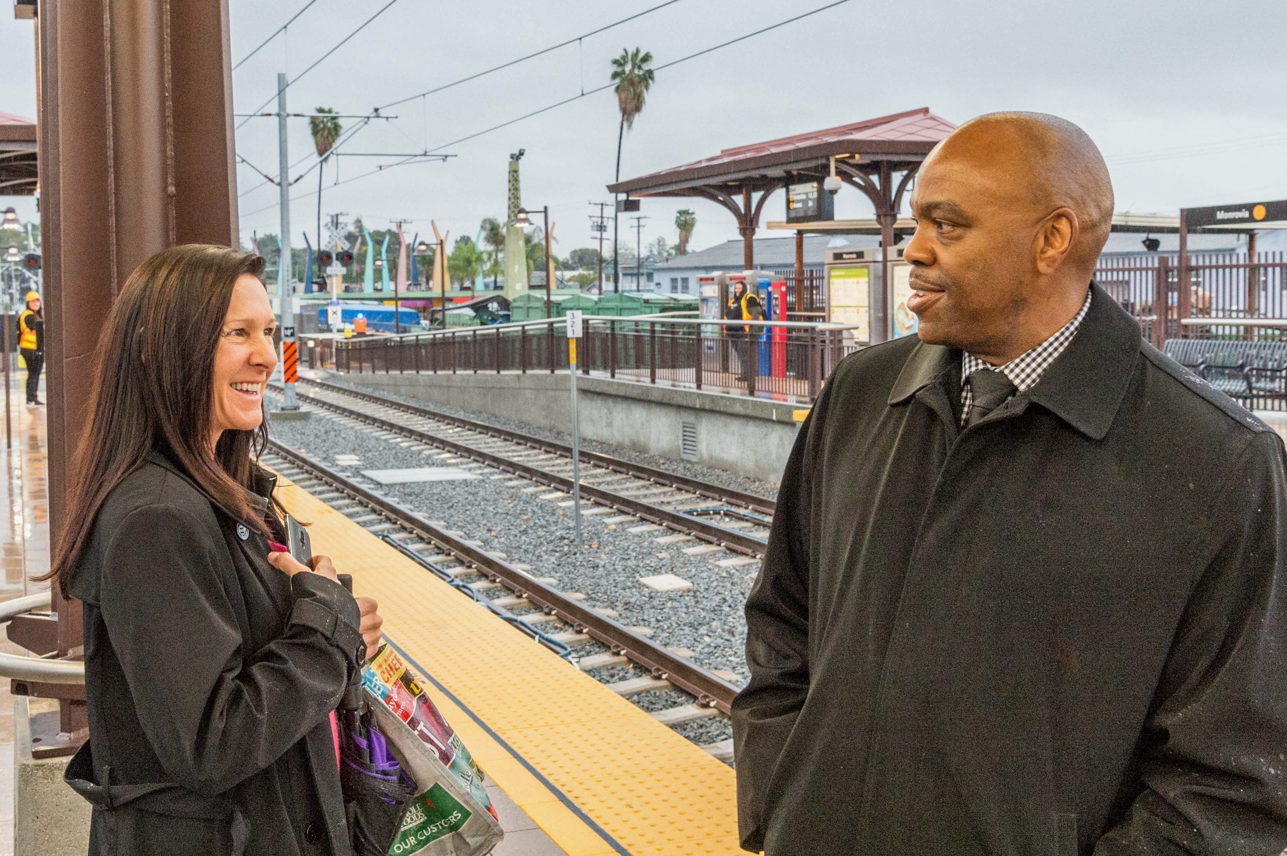 Metro CEO Phil Washington chatting with a customer at the Gold Line's Monrovia Station in March.