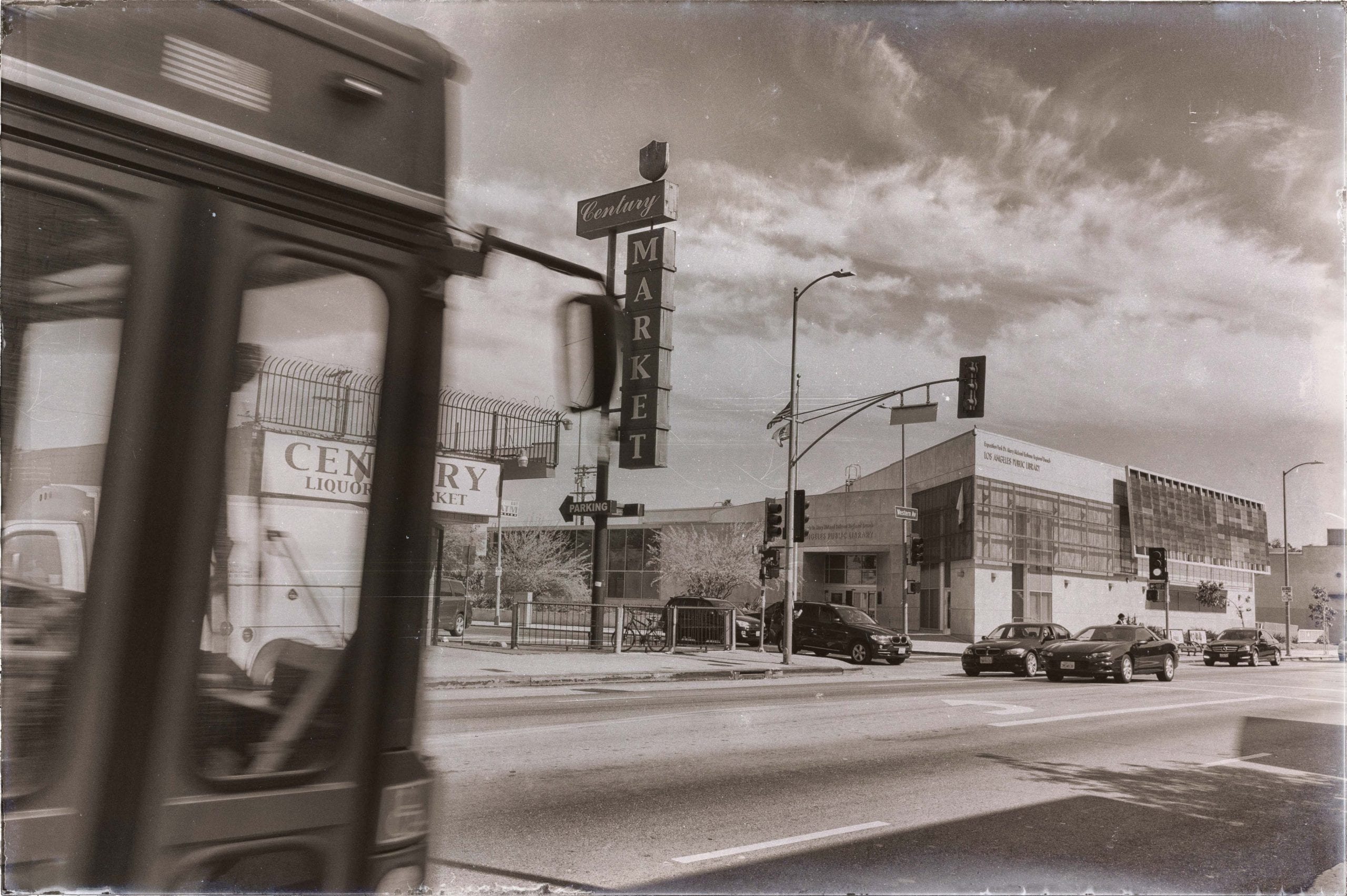 Bus + liquor store + public library on Western Avenue in South Los Angeles. Photo by Steve Hymon.