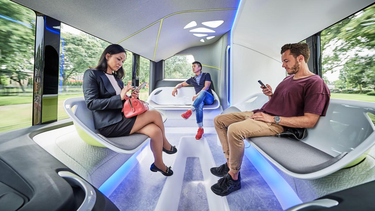 A pair of renderings of the Mercedes bus.