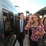 Metrolink Chairman RIchard Katz escorts Rose Queen Drew Helen Washington and Royal Court to Gold Line train for a ride to Heritiage Square Station.
