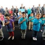 First graders from Science Center School lead officials in the Pledge of Allegiance. Photo: Gary Leonard