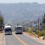 Metroliners pass near Parthenia Street between Nordhoff and Roscoe stations.